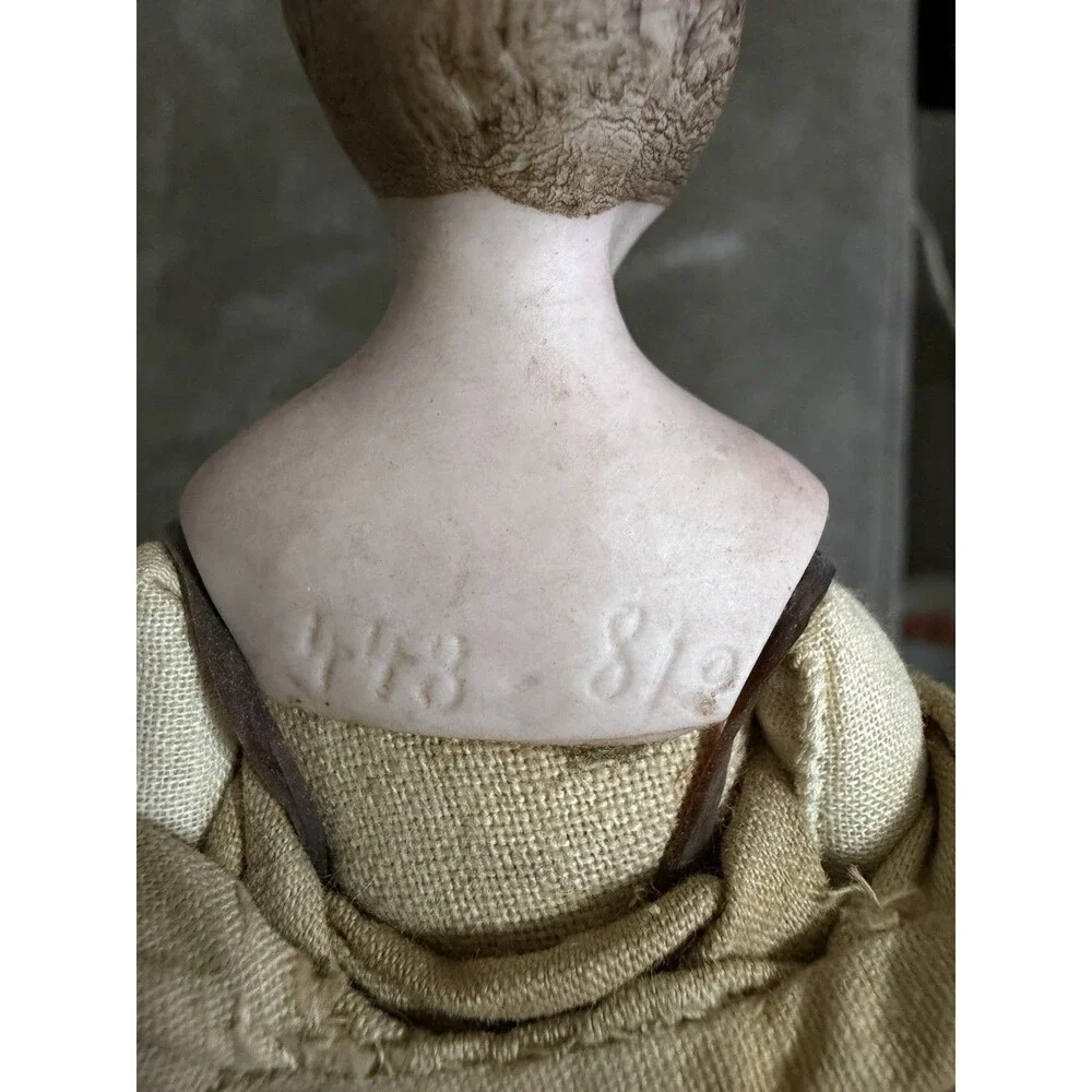 Antique German bisque gentleman doll, approximately 7 inches tall,